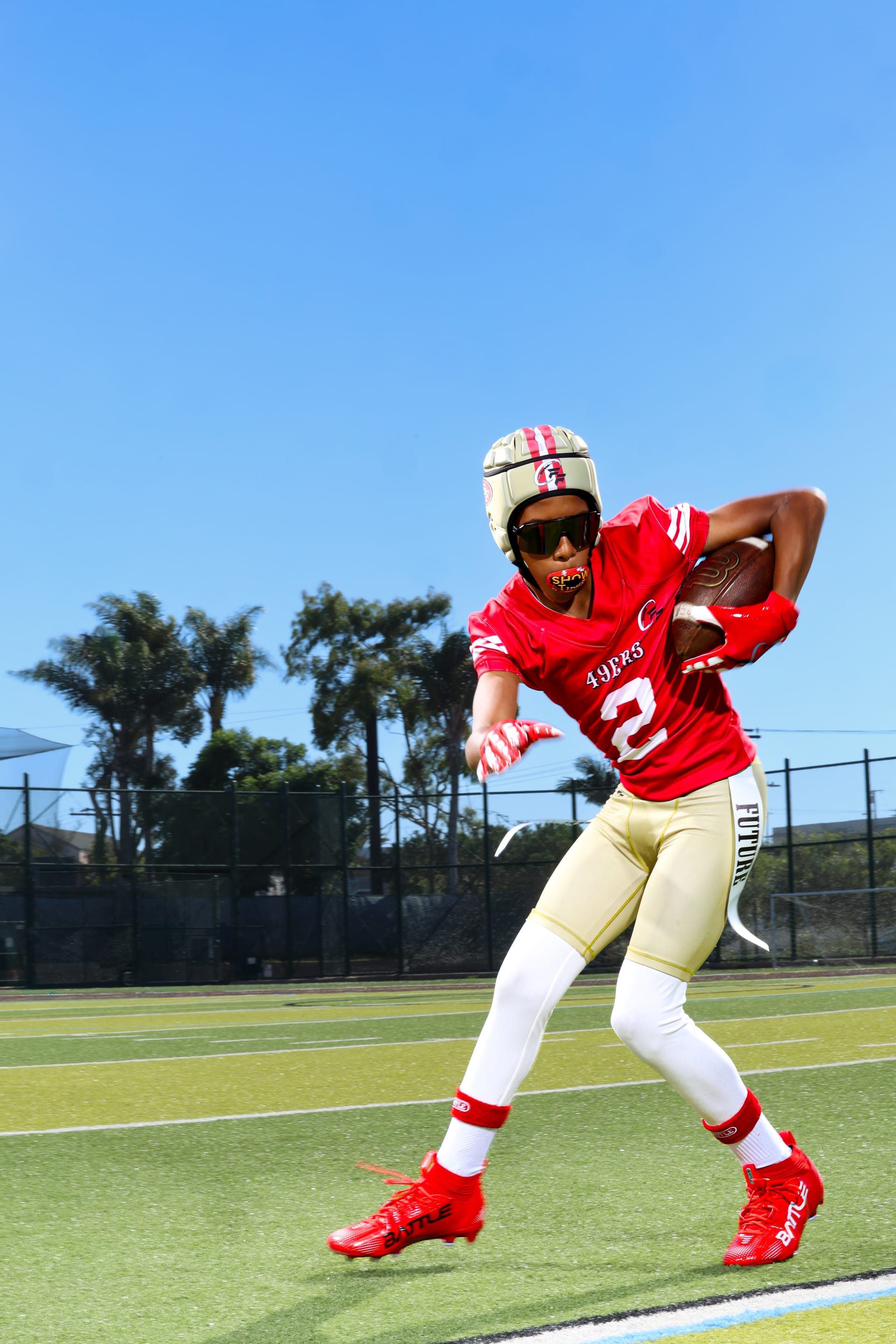 Player running with ball on field